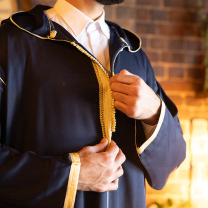 Close-up of the elegant embroidery on the chest and collar of the royal-navy-moroccan-djellaba, showing intricate details.