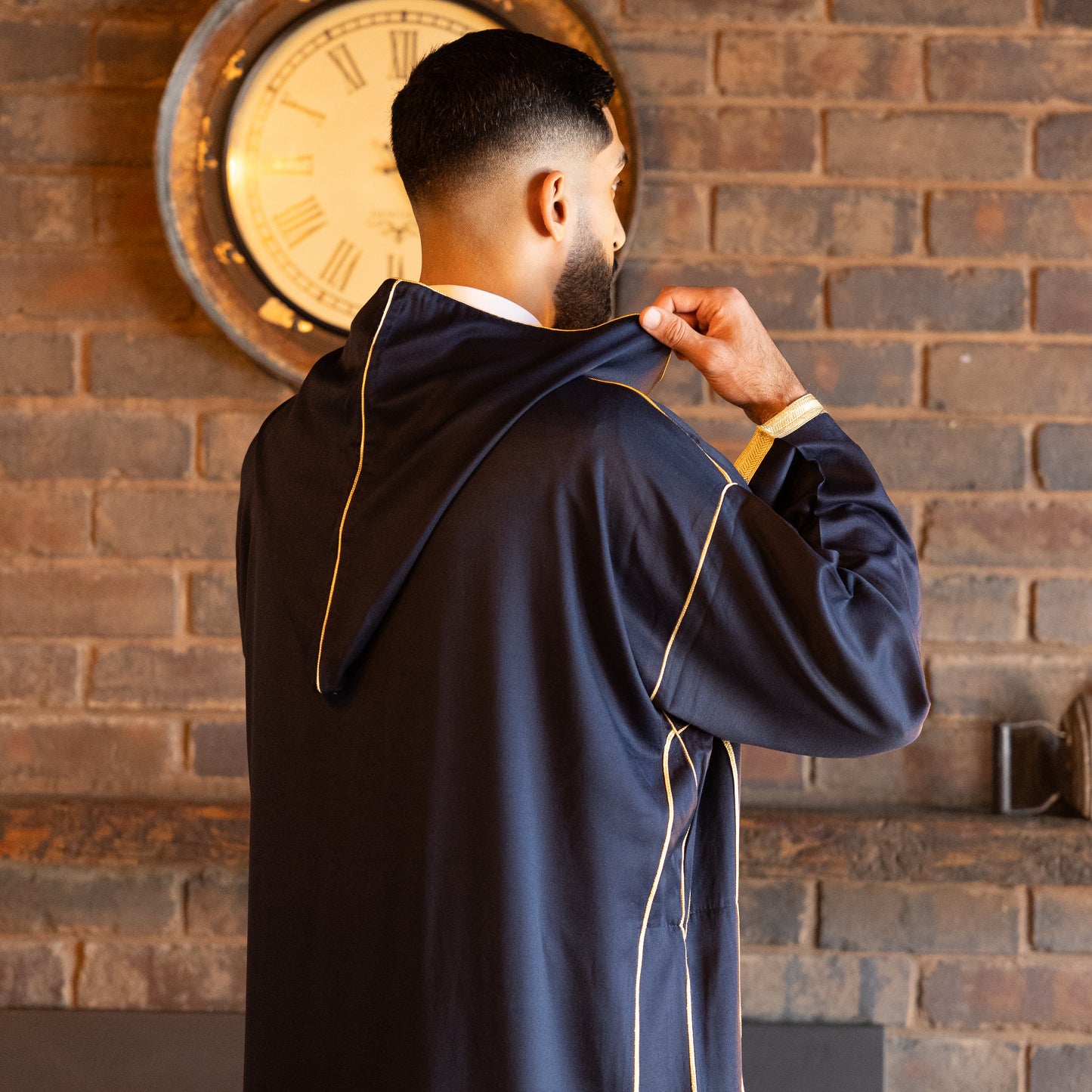 Back side view of elegant royal navy Moroccan djellaba