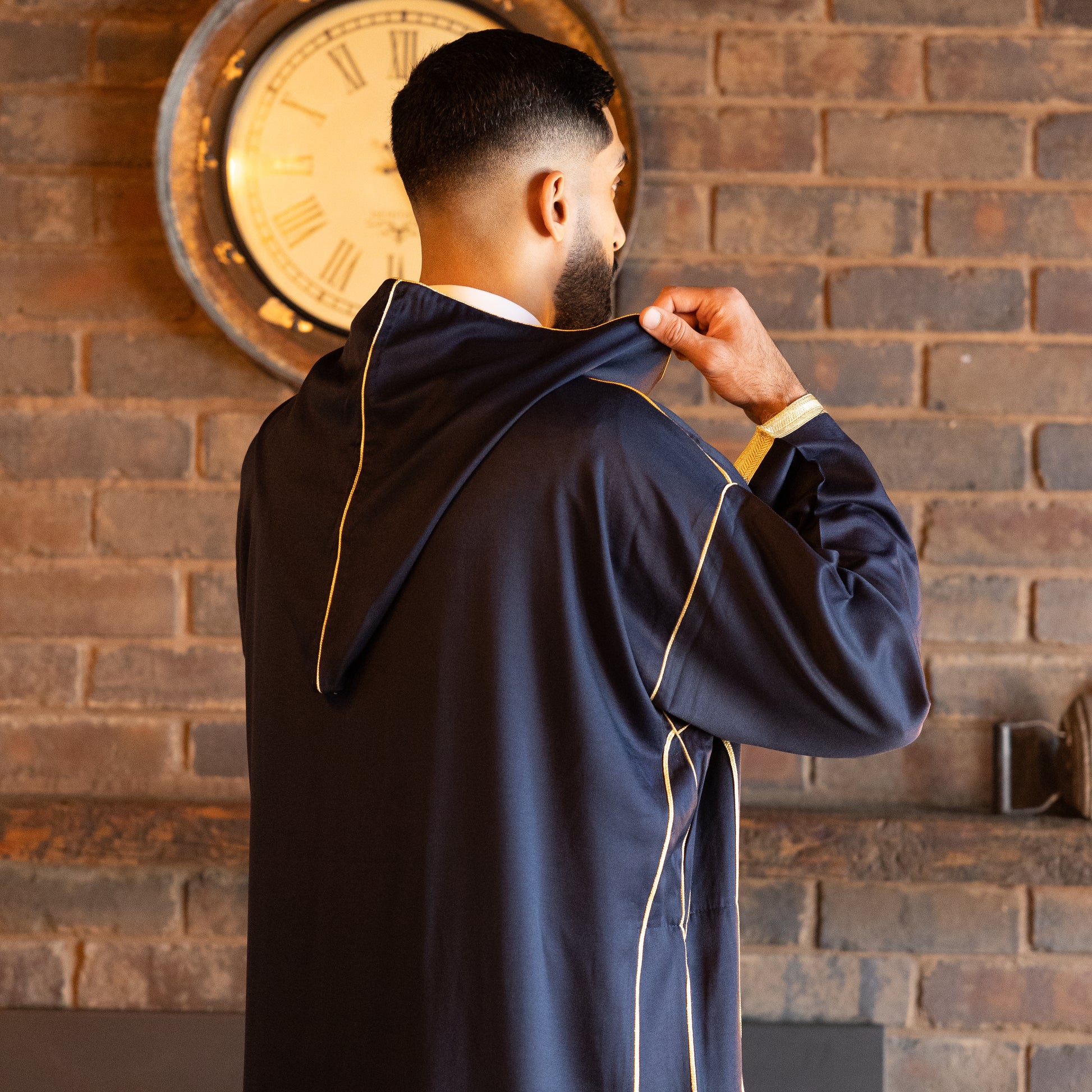 Back side view of elegant royal navy Moroccan djellaba