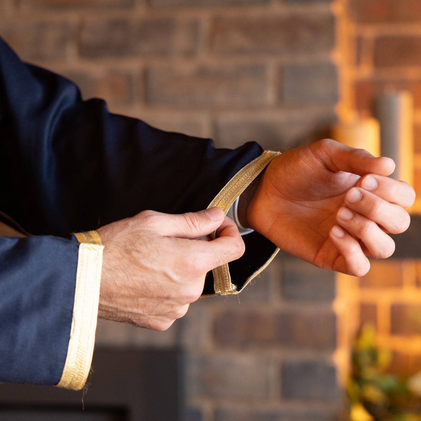 Close-up view of the intricate embroidery detail on the cuff of the royal-navy-moroccan-djellaba-